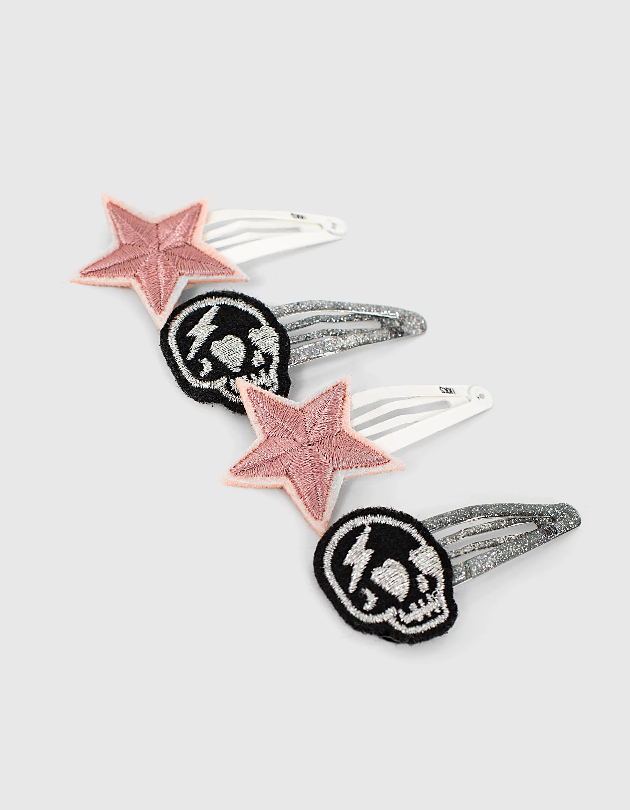 Barrettes dusty rose à étoiles et grises à skulls fille